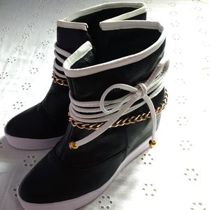 Wedged stylist boots, brand new. Size 9.